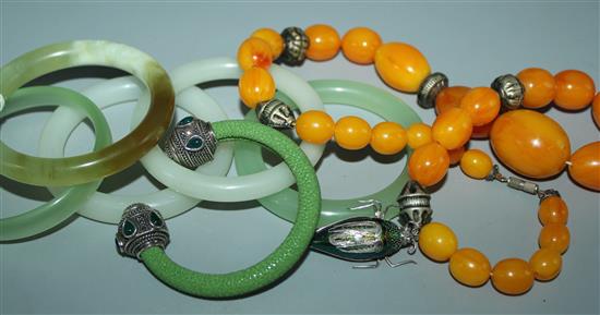 Collection of Jade bangles, beetle brooch & a necklace